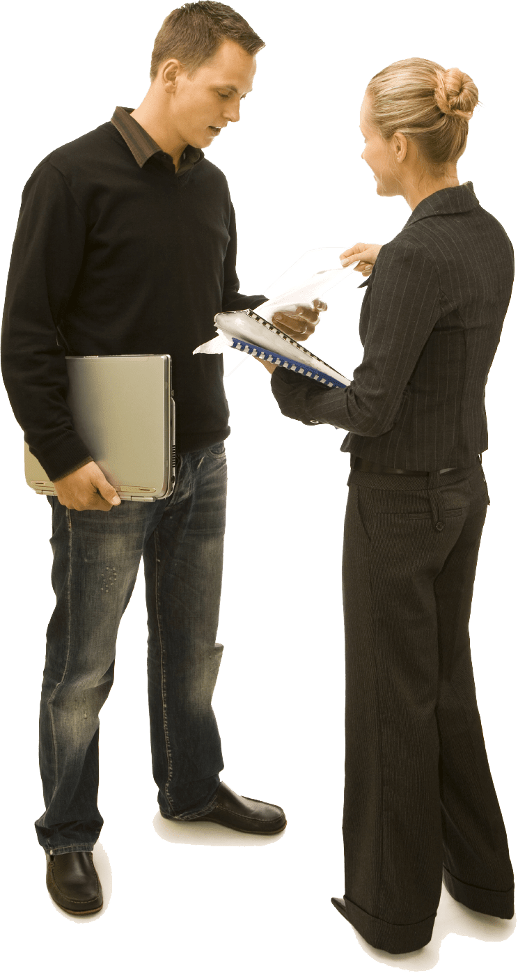 Two business colleagues discussing documents and a laptop in a professional setting